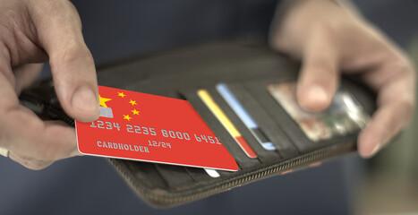 Man pulls credit card with flag of China out of his wallet, fictional card number