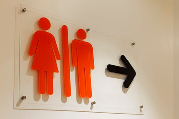 Toilet, orange wc icon, sign in supermarket, restaurant, lobby. Toilet room sign concept at...