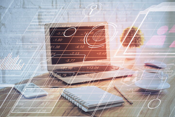 Double exposure of laptop computer and technology theme hologram. Concept of freelance work.