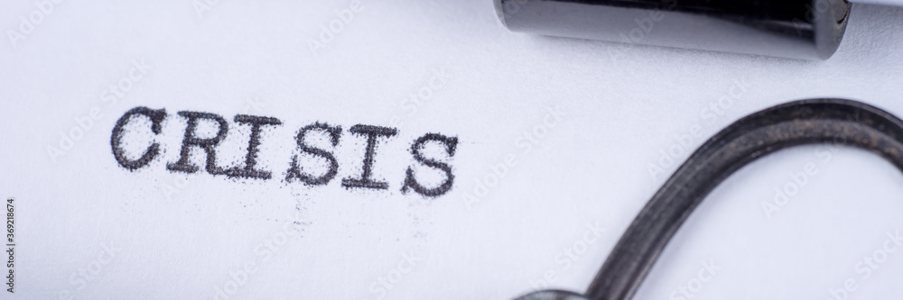 Poster crisis typed on retro typewriter. panoramic image