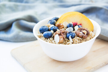 Oatmeal porridge with blueberries. Superfood for healthy nutritious breakfast