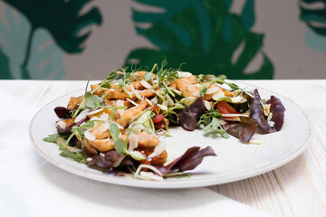 A large dish with Thai salad, a dish of Asian cuisine in the restaurant