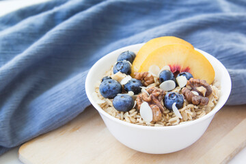 Oatmeal porridge with blueberries. Superfood for healthy nutritious breakfast