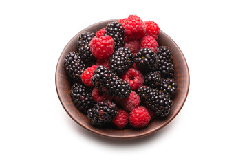 Raspberry, blackberry and mint leaf in ceramic brown bowl isolated on white