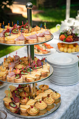catering in a country restaurant on a glade. Tables served with tablecloths
