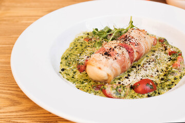 Bacon roll, delicious dish in the restaurant, close-up