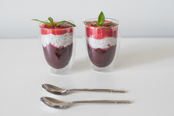 Delicious yogurts on a white table. Healthy deserts. Healthy concept of life. Soft selective focus