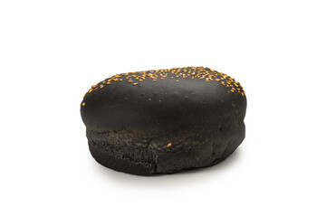 Black burger bread isolated on white.
