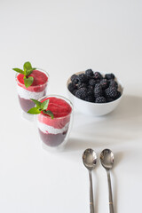 Delicious yogurts on a white table. Soft selective focus. Healthy desserts. Healthy concept of life