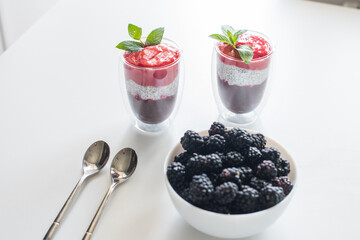 Delicious yogurts on a white table. Soft selective focus. Healthy desserts. Healthy concept of life