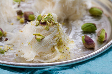 Turkish cotton candy - pishmanie with pistachios. Selective focus
