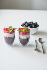 Delicious yogurts on a white table. Soft selective focus. Healthy desserts. Healthy concept of life