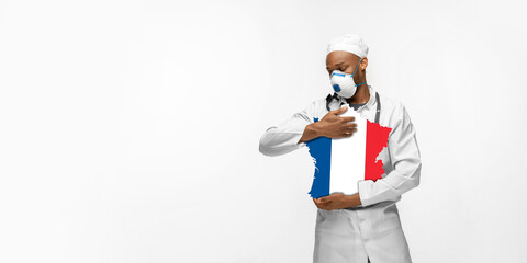 Beautiful african-american doctor cares about France over white studio background. Copyspace. Concept of healthcare and medicine, taking care, treatment, diagnostics during coronavirus outbreak.
