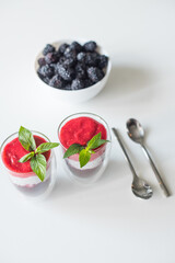 Delicious yogurts on a white table. Soft selective focus. Healthy desserts. Healthy concept of life