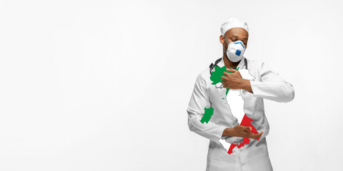 Beautiful african-american doctor cares about Italy over white studio background. Copyspace. Concept of healthcare and medicine, taking care, treatment, diagnostics during coronavirus outbreak.