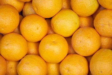 Fresh juicy oranges background texture.