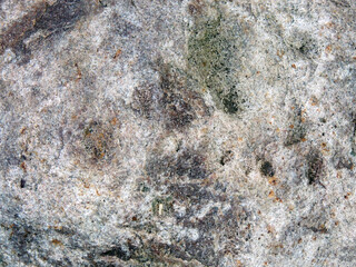 Texture of natural ordinary stone close-up.