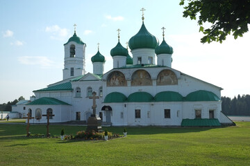 Fototapeta na wymiar Holy Trinity Alexander Svirsky monastery (1641), Preobrazhensky Cathedral (1644) and bell tower (1904). Leningrad region (2014).