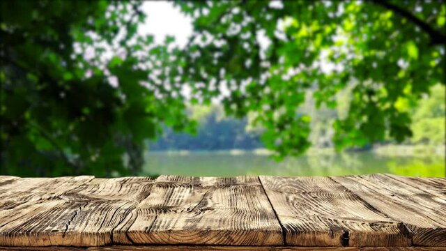 Wooden desk of free space and spring leaves. 