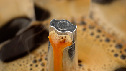 Coffee pours through the holes in the geyser coffee maker. geyser coffee maker. make coffee