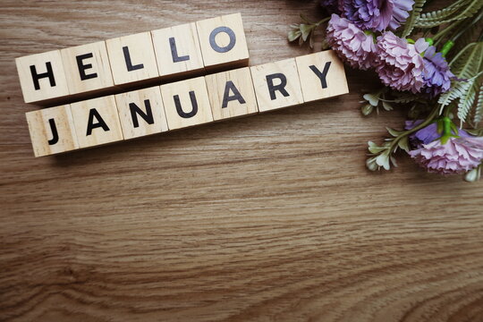 Hello January alphabet letters on wooden background
