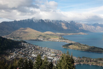 Aerial view of Queenstown and Lake Wakatipu with the Remarkables mountain range during Winter, New Zealand