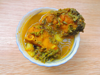 Famous Assamese recipe called Machor Tenga in Assam. This is a very popular and a signature dish of Assam. This is mild low spice tangy fish curry prepared with available vegetables and herbs. 