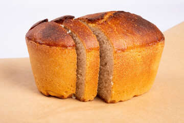 bakery products, freshly baked wheat bread, slices of bread, loaf isolated on white background, bakery