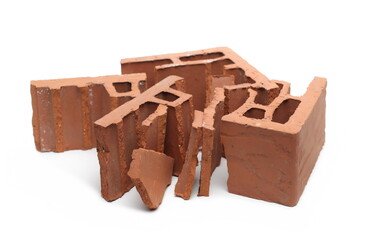Shattered perforated brick pieces isolated on white background