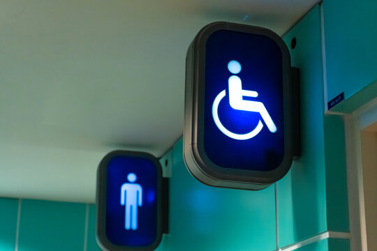 Information signs at the entrance to the toilet. Toilet for disabled people.