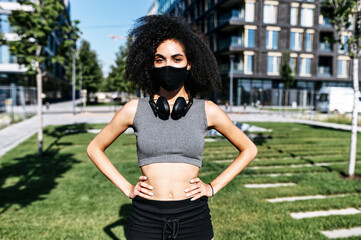 Sport in safety during quarantine. Close-up portrait of young beautiful multi-ethnic woman in...