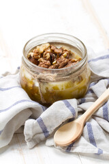Altai candied honey with walnuts in a glass jar