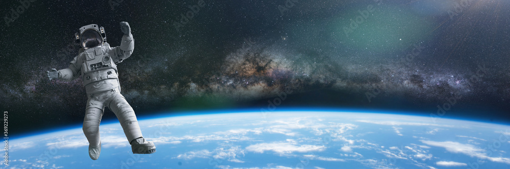 Sticker astronaut during a spacewalk in orbit of planet earth, background banner with empty space