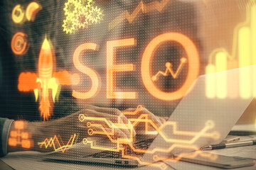 Double exposure of seo icon with man working on computer on background. Concept of search engine...