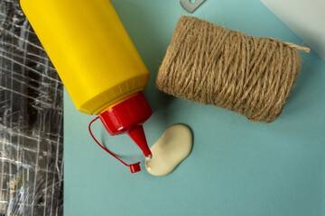 Brush, glue, twine composition