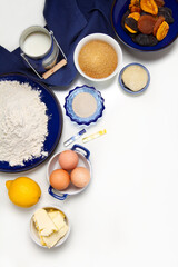 Traditional Russian Easter cake ingredients: flour, yeast, sugar, lemon, milk, eggs, butter, dried fruits, marzipan, vanilla and rum extract