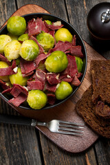 Stewed Brussels sprouts with cream, garlic and beef jerky