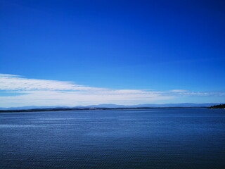 View of the Nysa lake in the background of the blue sky.