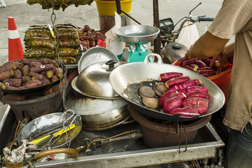 steamed sweet potatoes in banana leaf in Bangkok