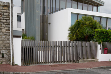 wooden brown natural modern gate of private house building