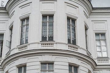 Fototapeta na wymiar Close up of big windows of manor. Texture of windows of historic white Palace.