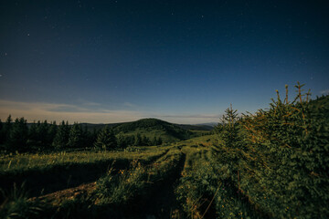 A sign on the side of a hill with Hollywood Sign in the background