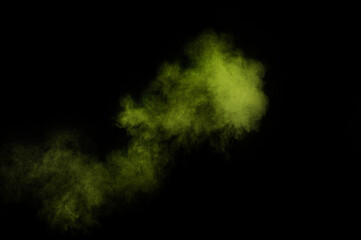 Light green powder explosion on black background. Colored powder cloud. Colorful dust explode. Paint  Holi.