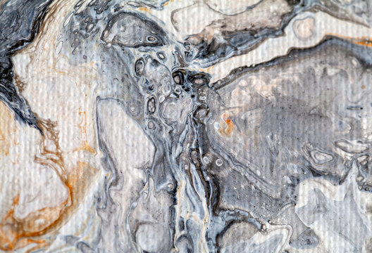Macro detail of a painting showing an imaginary underwater scene with a surrealistic butterfly, in grey and white tones with some golden sparkles and visible canvas texture.  