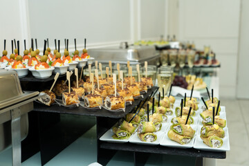 Festive buffet table with many snacks and appetizers