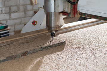 Woodwork cnc machine working on wood board. Tool at the wood factory.