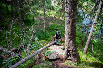 a girl descends from a cliff, overcoming obstacles