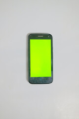 mobile phone with green screen and white background