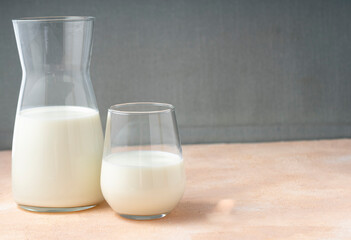 selective focus, dairy product in a glass container on a light table, milk, copyspace