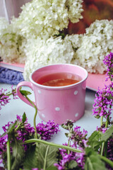Cup of tea flowers bouquet morning